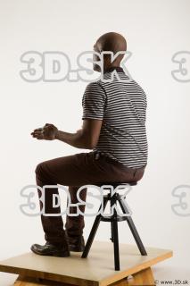 Sitting reference of whole body black white striped shirt brown…